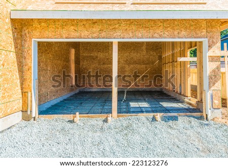 New residential home, garage under construction, framing. North America.