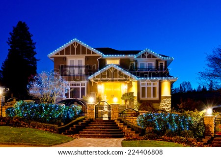 Nicely decorated  house in suburbs of Vancouver at dusk, night time.  Canada.