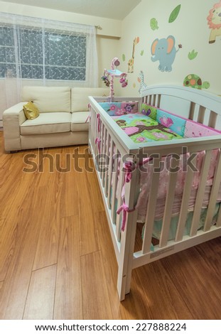 Modern comfortable, nicely decorated children, baby bedroom. Interior design.