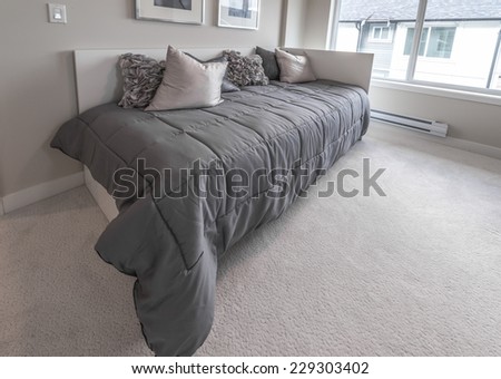 Luxury nicely decorated modern bedroom. Interior design of a brand new house.