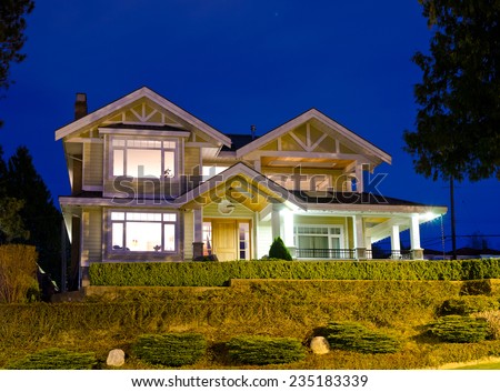 Big luxury house at night ( dawn ) time in suburbs of Vancouver. Canada.