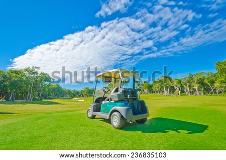 Golf cart at the beautiful golf course at the luxury caribbean, mexican resort.