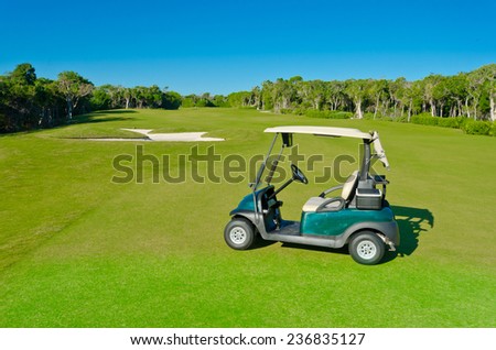 Golf cart at the bunker  on the beautiful  golf course of a luxury Mexican resort.