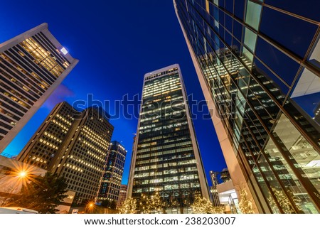 Night scene of modern colorful city life with skyscrapers, highrise buildings. Vancouver downtown  at night.