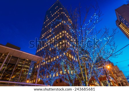 Night scene of colorful city life with skyscrapers, highrise buildings. Vancouver downtown  at night.