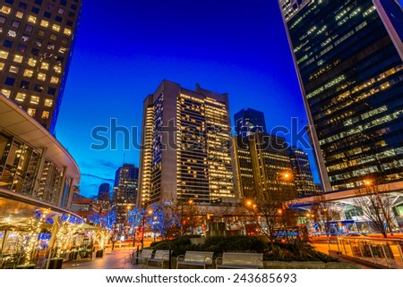 Night scene of colorful city life with skyscrapers, highrise buildings. Vancouver downtown  at night.