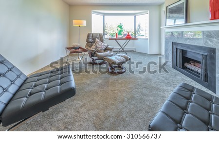Interior design of luxury nicely decorated modern living room, suite with some leather chairs. Interior design.