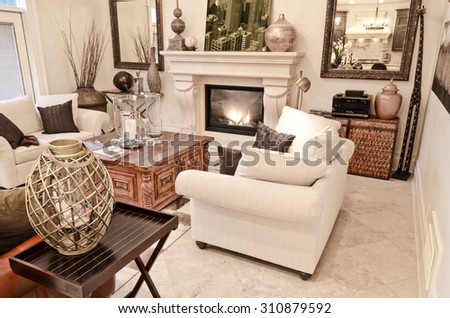 Luxury living room with a lot of decorations and a marble floor. Interior design.