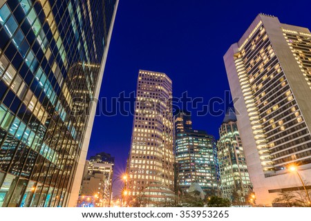 Night scene of colorful city life with skyscrapers, highrise buildings. Vancouver downtown at night.
