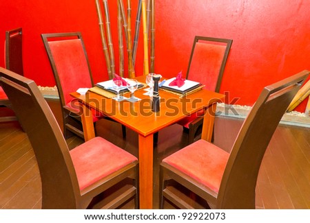 Interior, dining table in a luxury asian style restaurant.