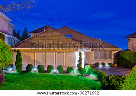 A big luxury house in suburbs of Vancouver at dusk ( night ) time.  Canada.