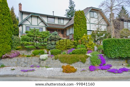Landscape Design. Nicely Trimmed Bushes And Some Flowers At The ...