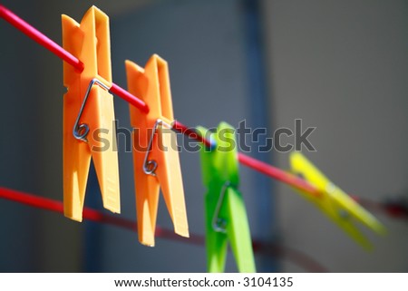 Clothes-pins on the red rope
