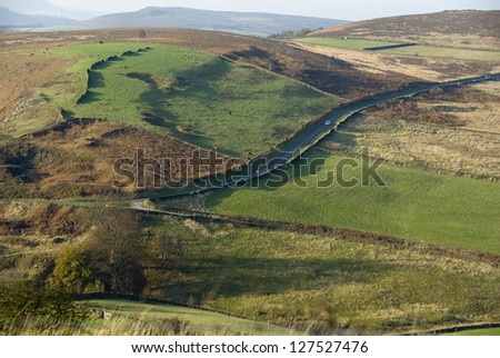 Country Lane Passing Through Green and Brown Patchwork of Moorland Fields, Derbyshire, Dark Peak, Peak District, UK