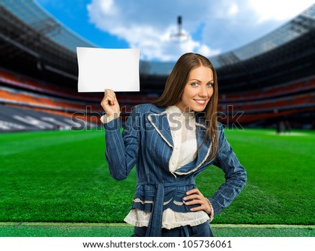 soccer, woman on playing field showing information