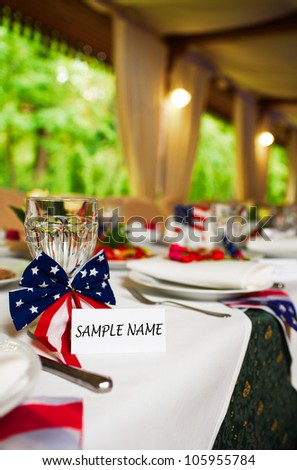 Blank event Guest Card on restaurant table with american flag