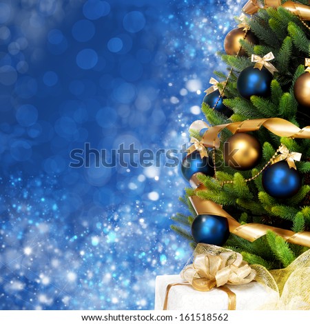 Magically Decorated Christmas Tree With Balls, Ribbons And Garlands On A Blurred Blue Shiny, Fairy And Sparkling Background
