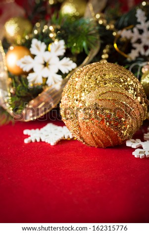 Christmas background with gold balls and red copy space for your text