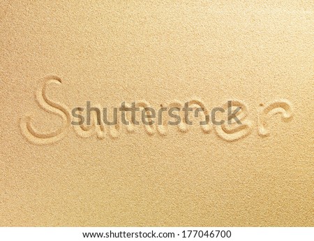 The word Summer is written on the sand background in the center of the picture
