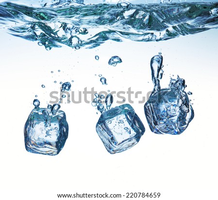 A lot of ice cubes on white background poured in water