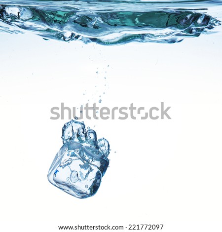 Ice cubes on white background poured in water