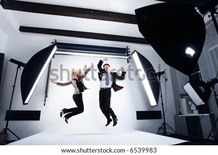 businessman and woman in a modern photo studio