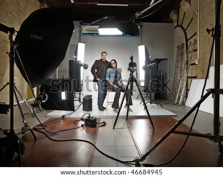 man and woman in a modern photo studio
