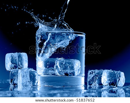Close up view of the ice cubes splash in water on black