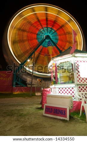 Ice Cream Stand at Carnival with Ferris Wheel