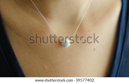 Female jewelry necklace with beads on a model\'s neck