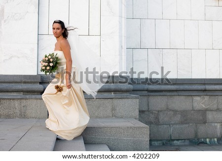 bride in front of a church just before ceremony