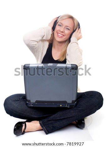 young woman with laptop listening to music or surfing the net