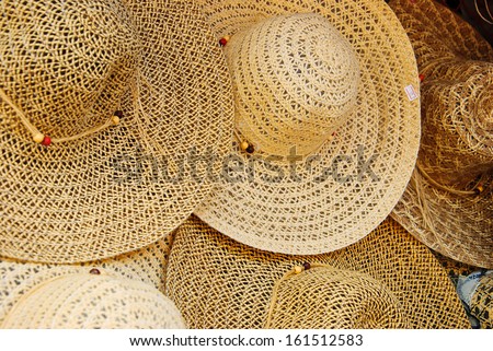 Handmade straw hats on sale in market