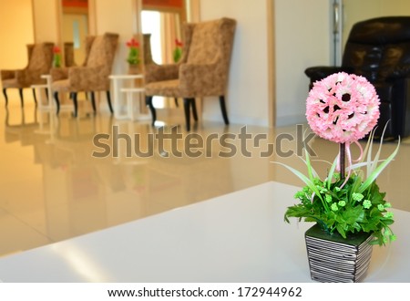 Vase of flowers in a hotel room