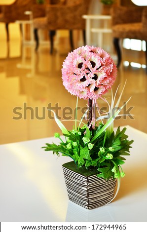 Vase of flowers in a hotel room