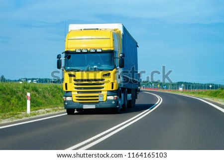 Truck in the highway in Poland. Lorry transport delivering some freight cargo.