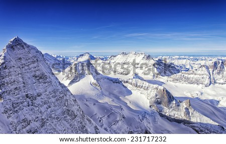 Raw of snow peaks in Jungfrau region helicopter view in winter