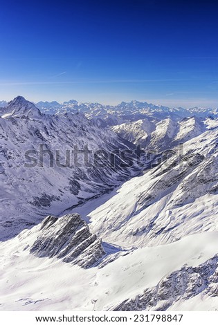 Valley in Jungfrau region helicopter view in winter with sunshine