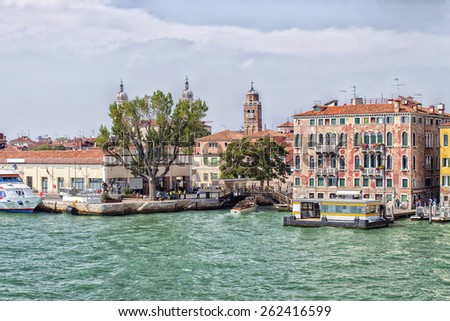 Quay and bridge over channel and water bus stop in Venice