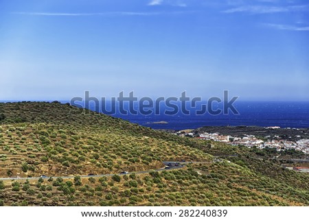 Mediterranean sea bay near Cassis, Provence, Cote d`Azur and serpentine road view from mountains