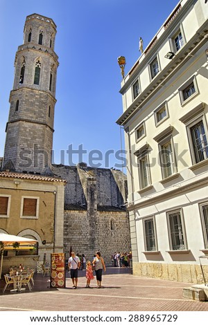 FIGUERES, SPAIN - AUGUST 06, 2010: People on the square near Dali theater-museum in Figueres, Spain