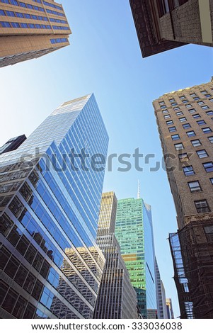 NEW YORK, USA - MAY 5, 2015: Looking up at skyscrapers in Lower Manhattan, New York City, USA