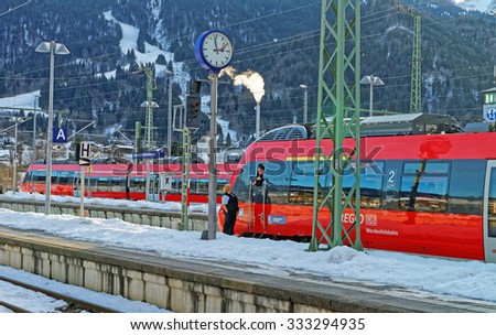 GARMISCH-PARTENKIRCHEN, GERMANY - JANUARY 6, 2015: View of the train driver awaiting departure at Garmisch-Partenkirchen train station on a sunny winter afternoon. Bavaria. Germany