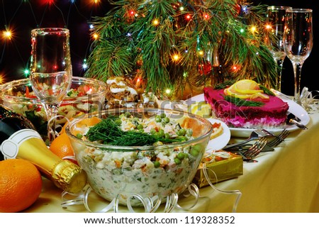 Russian New Year dinner with traditional salads.