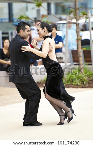 GOLD COAST - AUSTRALIA - 18 MARCH: Unidentified  pair dancing tango on Japan & Friends Day festival.  18 March 2012 on Gold Coast,  Australia.  Street dancers performing tango
