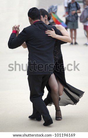 GOLD COAST - AUSTRALIA - 18 MARCH: Unidentified pair dancing tango on Japan & Friends Day festival. 18 March 2012 on Gold Coast, Australia. Street dancers performing tango