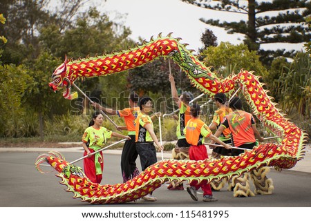 GOLD COAST, AUSTRALIA - SEPT  30: Four unidentified teams compete in the 2012 Dragon Dancing on the Broad Waters on September 30, 2012 in Gold Coast
