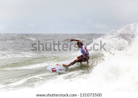 SNAPPER ROCKS, GOLD COAST, AUSTRALIA - 9 MARCH: Unidentified Surfer races the Quiksilver & Roxy Pro World Title Event. 9 March 2013, Snapper Rocks, Gold Coast, Australia