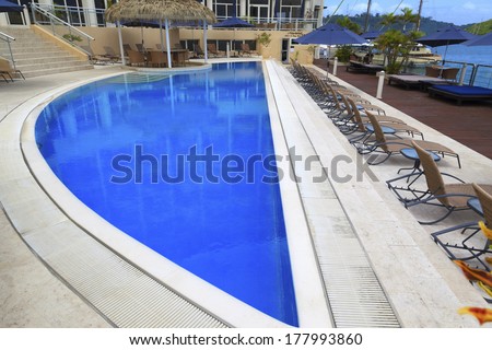 GRAND HOTEL,VANUATU - FEB 27: Scenery of the swimming pool at the Grand Hotel Resort & SPA. The renovated hotel is the hub of tourists whom enjoy the view and pristine waters on Feb.. 27, 2013.