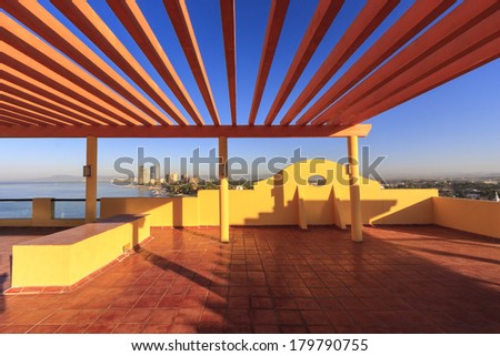 Perspective, outlook at the modern stylish balcony, deck, patio of the restaurant, cafe, bar of the luxury Mexican resort. Exterior, interior design.